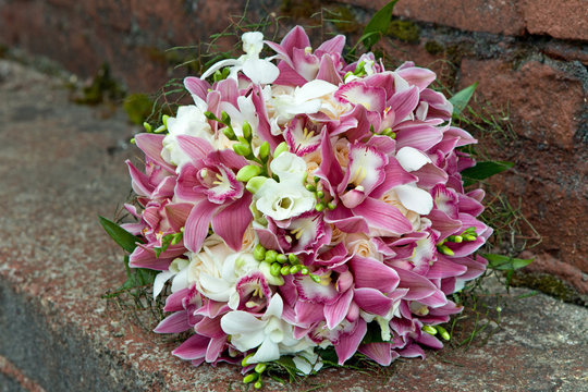 Bouquet from orchids, roses, irises and other flowers