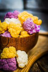 Colorful cauliflower on rustic background