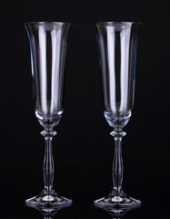 empty glasses for champagne isolated on black