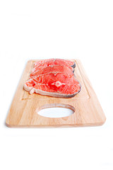 Red salmon steak on board