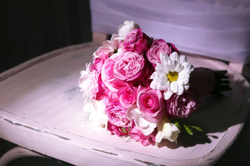 Beautiful wedding bouquet on chair