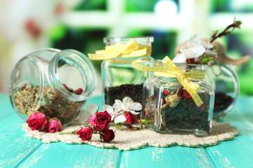 Assortment of herbs and tea in glass jars