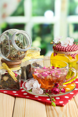 Assortment of herbs, honey and tea in glass jars