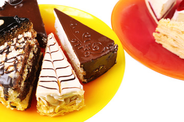 Assortment of pieces of cake, isolated on white © Africa Studio