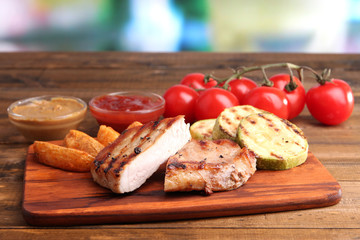 Grilled steak, grilled vegetables and fried potato pieces