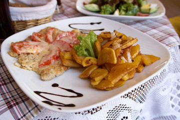 Juicy meat with fried potato