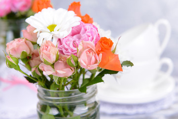 Beautiful bouquet of bright flowers in jar