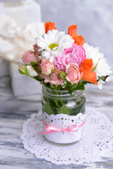 Beautiful bouquet of bright flowers in jar