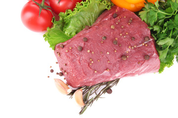 Raw beef meat with vegetables and spices isolated on white