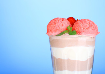 Tasty chocolate mousse with sorbet on blue background