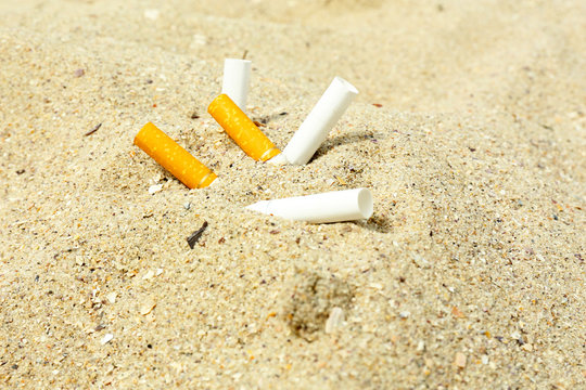 Cigarette Butts  On The Beach