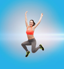 sporty teenage girl jumping in sportswear