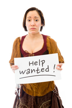 Young woman looking sad and showing help wanted sign on white ba