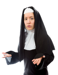 Young nun shrugging