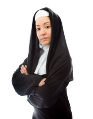 Young nun with her arms crossed