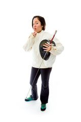 Female fencer standing with finger on lips