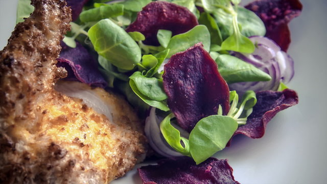 Chicken supreme baked breaded Pancho served withbeetroot chips