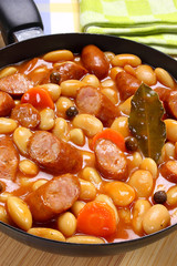 Beans with tomato sauce and sausage