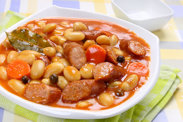 Beans with tomato sauce and sausage