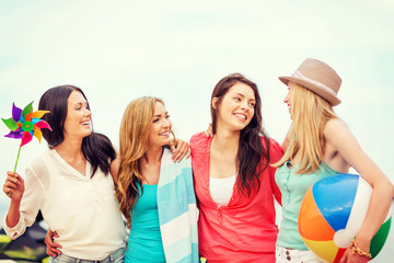 girls with ball on the beach