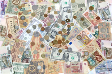 Many coins , banknotes of different countries and times. Money.