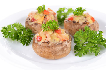Stuffed mushrooms on plate isolated on white