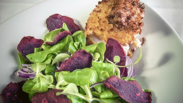 Chicken supreme baked breaded Pancho served  with beetroot chips