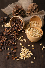 Cedar pine nuts in bowls, on wooden table