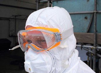 Industrial Cleaner wearing his full ppe for a boiler clean