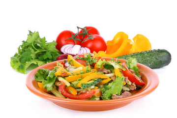 Beef salad on plate with vegetables isolated on white
