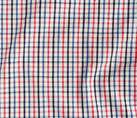 Texture of a red and white checkered picnic blanket.