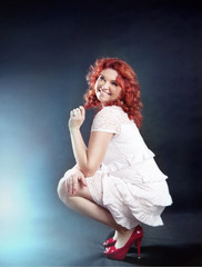 Romantic redhead woman posing.