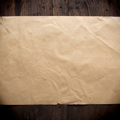old brown paper on wood background