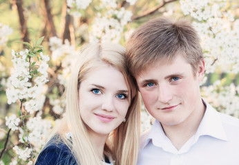 Fototapeta premium portrait of young couple in spring gadren