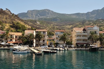 Fototapeta na wymiar Port of Podgora with apartments, boats and with Biokovo. Croatia