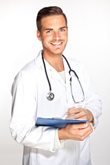 Portait of young male doctor with stethoscope and clipboard