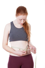 Young girl checking her weight loss