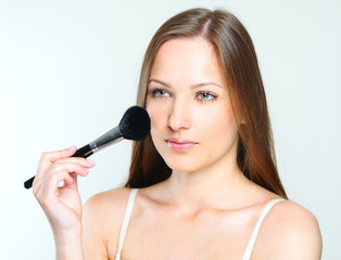  woman making makeup. perfect clean skin.