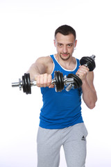 Fototapeta na wymiar Muscular man working out with dumbbells on white background