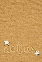 Word relax and seashells on the sand
