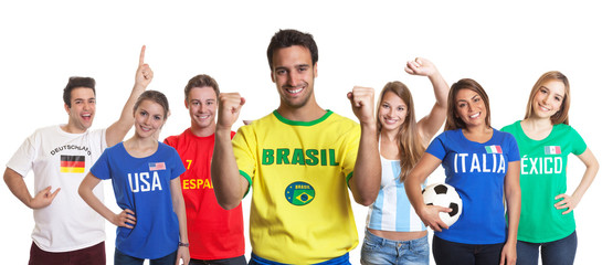 Happy sports fan from Brazil with other fans