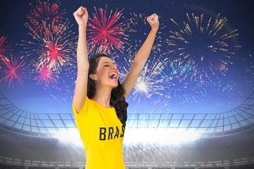 Fototapeta na wymiar Excited football fan in brasil tshirt
