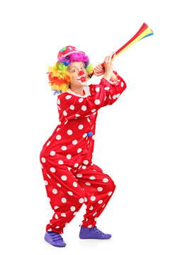 Female Clown Blowing A Horn