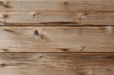 Sun bleached cedar siding with knots