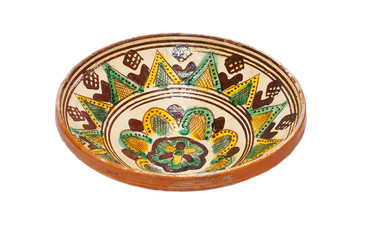 ancient plate from ceramics with ornament on a white background
