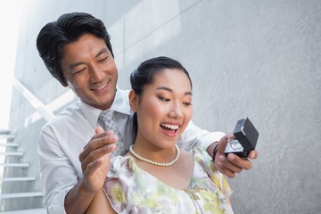 Man proposing marriage to his shocked girlfriend