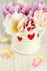 bouquet of tulips on wooden surface