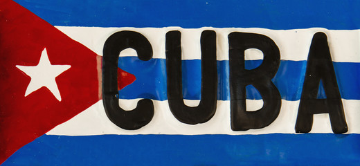 Red-blue-white Cuban flag on metal plate, Cuba, Republic of Cuba - 64670495