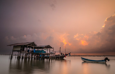 hut and fishing boat on laemsai beach