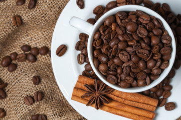 Coffee beans and coffee cup close-up